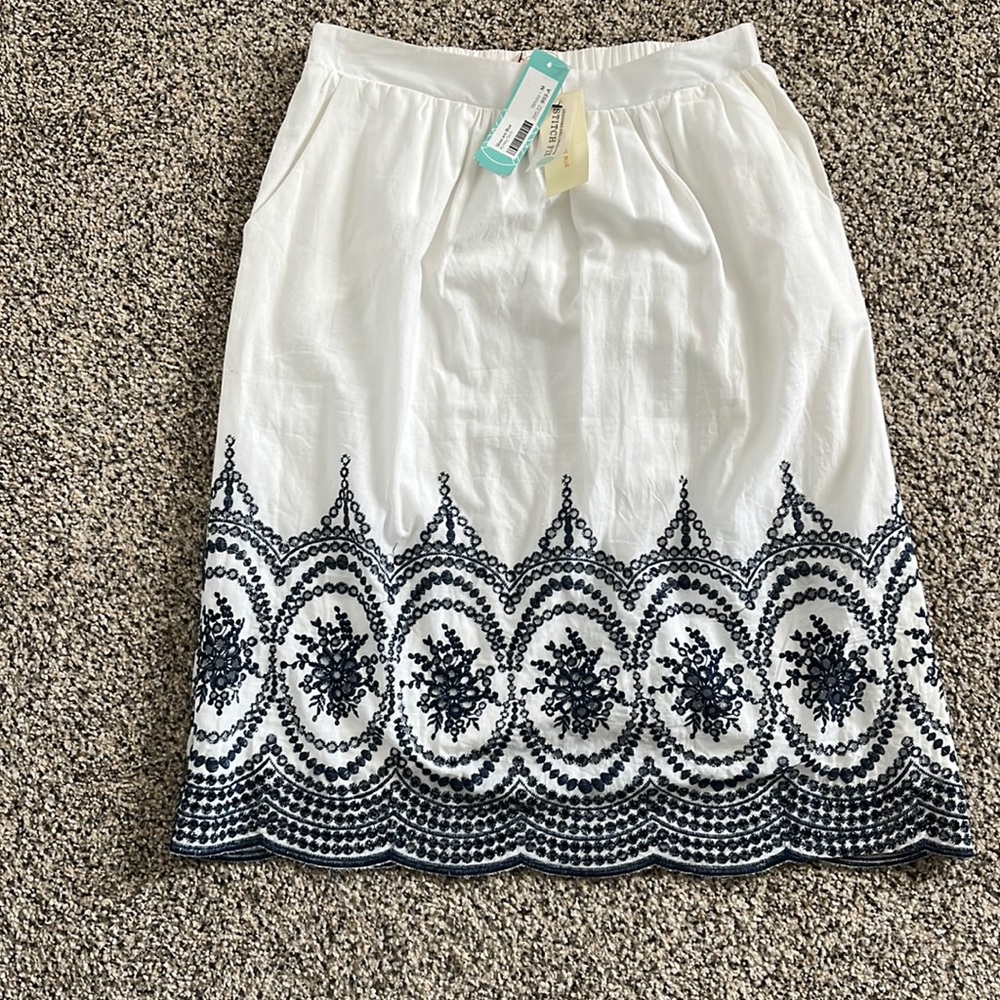 Skies are Blue white and navy skirt Medium